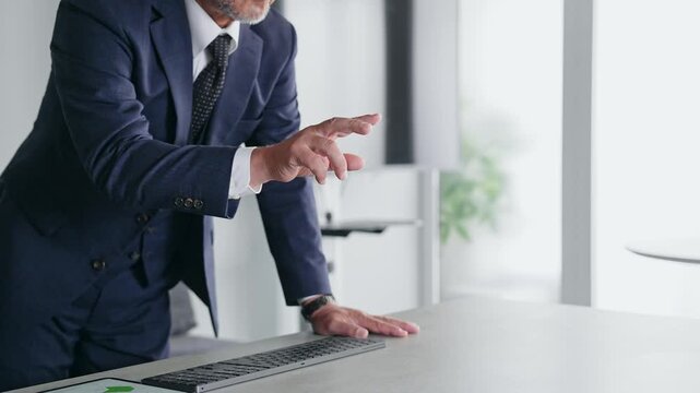 A male business professional interacting with a screen in mid-air. VR, virtual, DX, business, IT, touch, operation, screen.