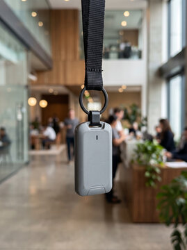 Corporate electronic key fob hanging on lanyard