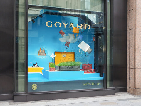 TOKYO, JAPAN - June 5, 2026: Display of Goyard trunks and bags in a window of Ginza's Mitsukoshi Department Store.