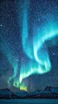 Aqua Blue Aurora Sky Over Snow Mountains - Breathtaking aqua blue aurora lights gracefully dance across a star-filled night sky, illuminating snow-capped mountains and a frozen landscape below.