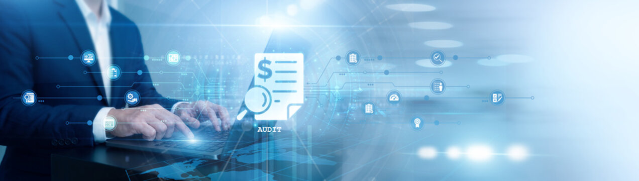 Financial auditor working on laptop. Audit compliance review. Specialist checking account records and tax regulations. Internal corporate governance and professional financial auditing.
