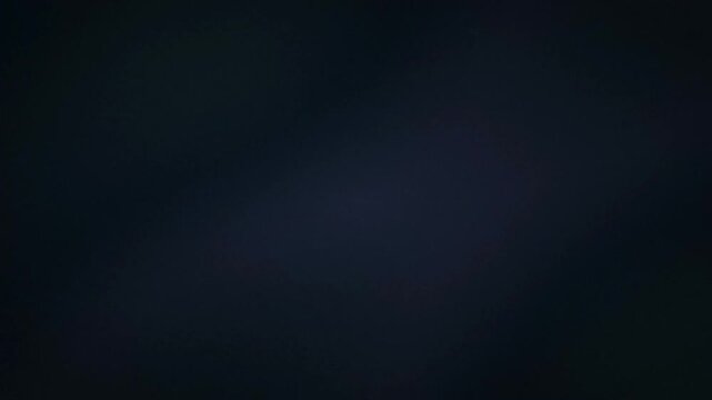 A completely dark, featureless, and abstract image with a subtle deep blue-black gradient.