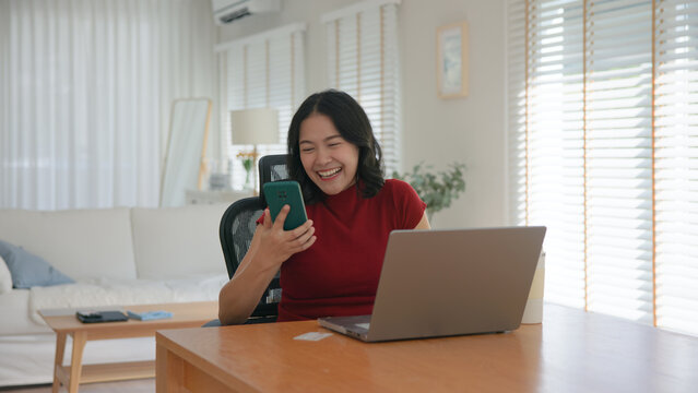 Young asian woman happy smile using search on phone Agent AI app retail shop store pay buy at home Modern Agentic bot order assisted people easy booking hotel ticket vacation smart life virtual wallet