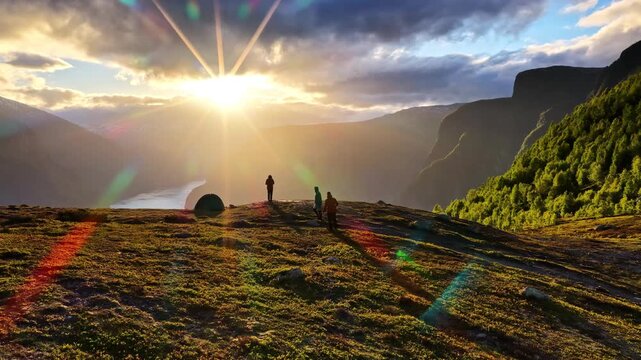 People enjoy Norway&rsquo;s stunning fjord landscape during a beautiful sunset outdoors.