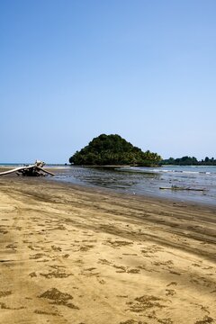 Wild Indonesian coastline facing verdant islets