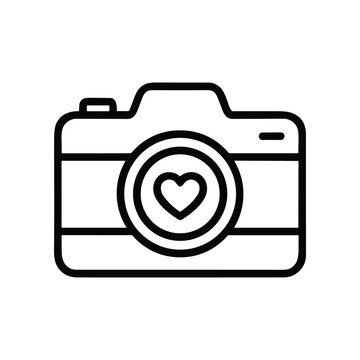 Simple line art icon of a camera with a heart symbol on the lens, representing love for photography.