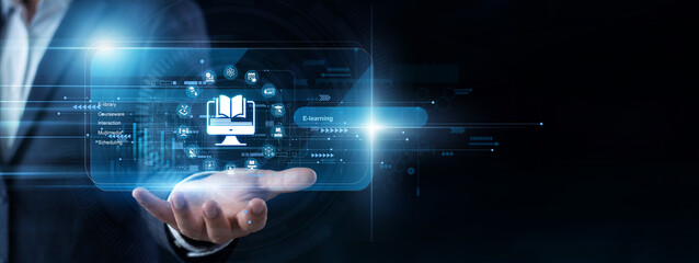 Online educator uses a handheld tablet to navigate a virtual screen presenting new E-learning courses. Interactive digital lessons and student engagement metrics are tracked efficiently. © NexPix