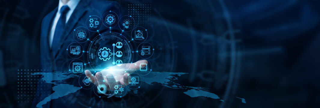 Operations manager hand holding tablet reviewing integrated corporate systems for ERP implementation and resource planning. Centralized business software streamlining global supply chains.