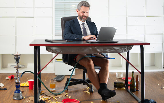 Comic Businessman. Funny business man during a video conference in messy office. Crazy business concept. Fun business team online. Humor in business. Messy funny office workspace.