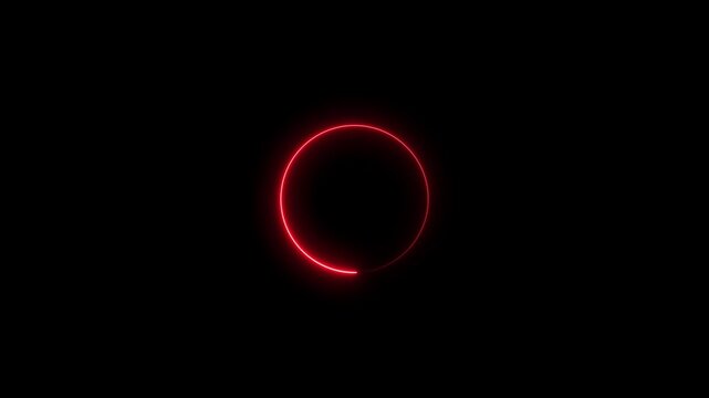 Abstract glowing red circle made of small particles rotating in darkness