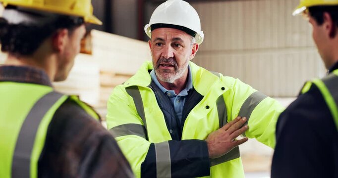 People, safety and reflective jacket in factory with discussion, explain rules and gear for carpentry. Manager, men and talk in workshop with PPE, woodwork manufacturing and compliance with protocol.