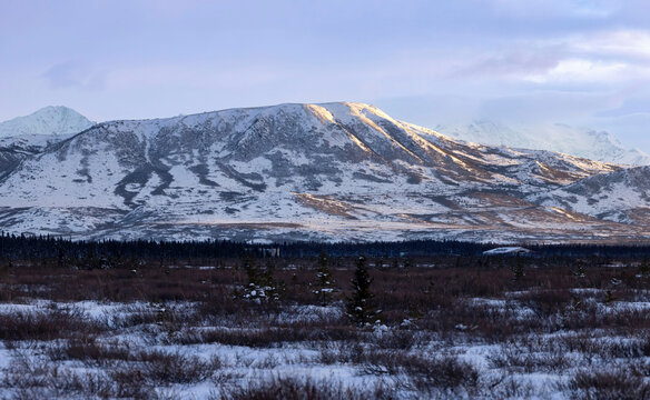 Sun shining on part of mountain