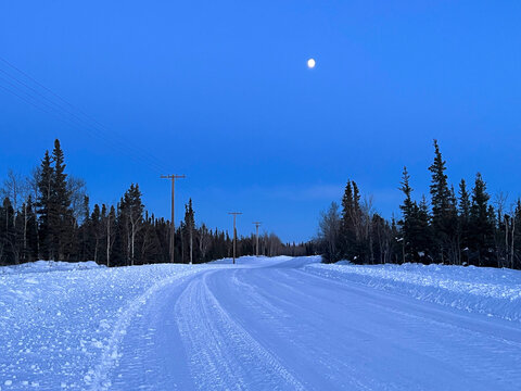 Moon in a blue sky on a winter day