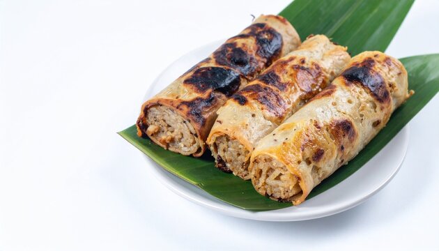 Pulut Panggang grilled glutinous rice rolls isolated on a white background with generous copy space