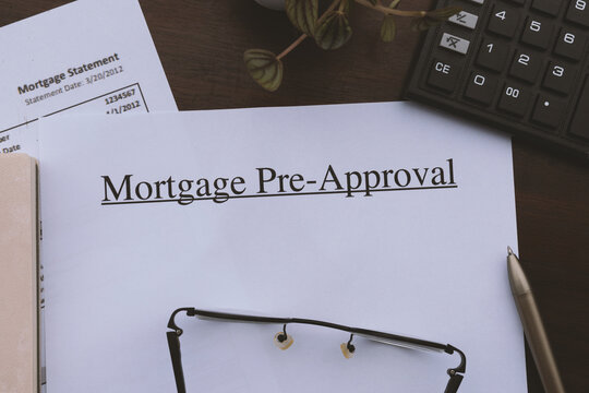 Financial paper for a home loan pre-approval application in a flat lay view.