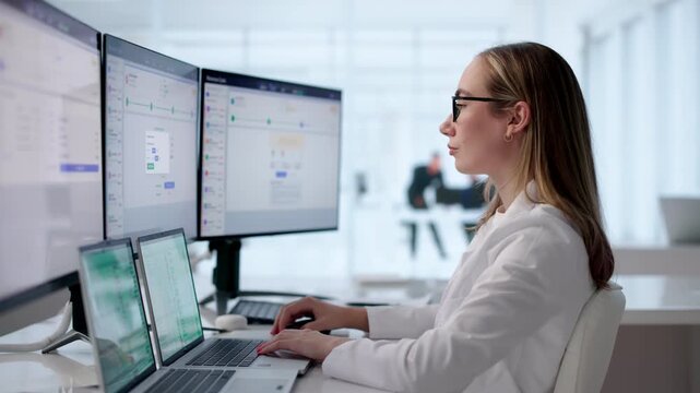 Medical Billing Specialist Reviewing Patient Claims On Laptop