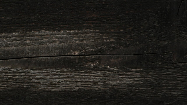 rough textured dark wooden surface with empty space