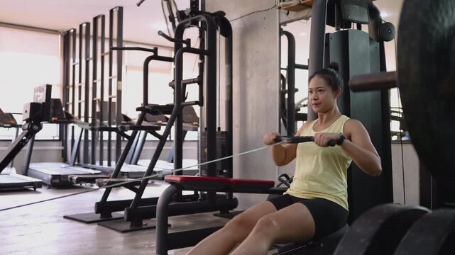 Hyrox race row pull heavy effort HIIT sport active asia people young Gen Z woman self care. High VO2 max cross power full core body hybrid cardio muscle weight loss anti aging modern gym living.