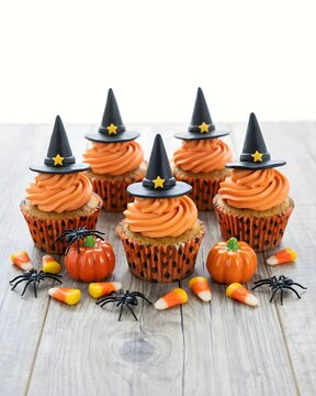 Spooky halloween witch cupcakes festive orange frosting miniature hats spider decorations for a delightful treat