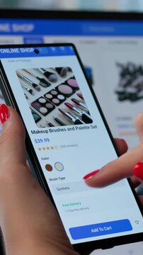 Young Woman Using Smartphone And Laptop To Shop Online