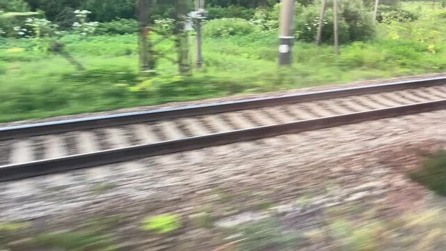 railway tracks viewed from moving train