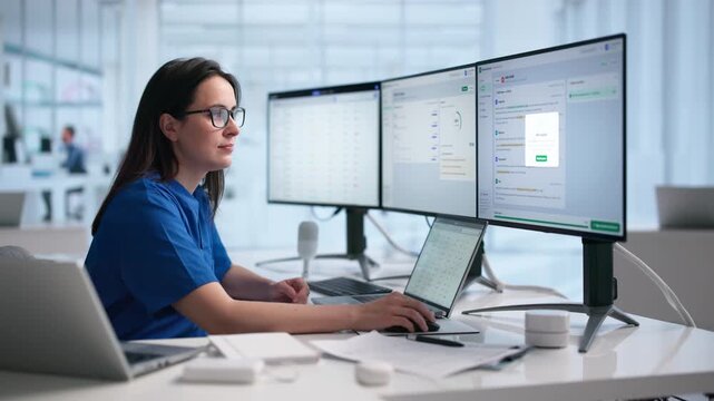 Physician Reviews Clinical Notes On Laptop
