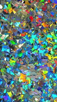 Iridescent holographic flakes slow rotation. Close-up of dense multicolored shiny fragments with vibrant blue, cyan, orange and gold reflections.	