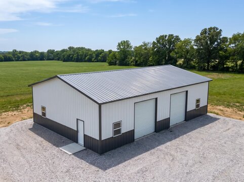 3D Illustration of Open Front Metal Barn Building in Rural Landscape