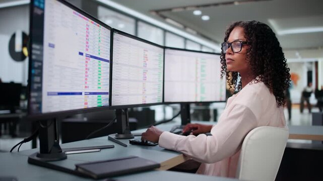 Medical Biller Carefully Reviews Coding Data On Computer