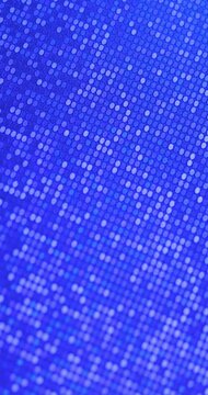 Dense sparkling sequins in vibrant colors tones, smooth rotation in seamless loop. Ideal for fashion, party and glamour backgrounds.