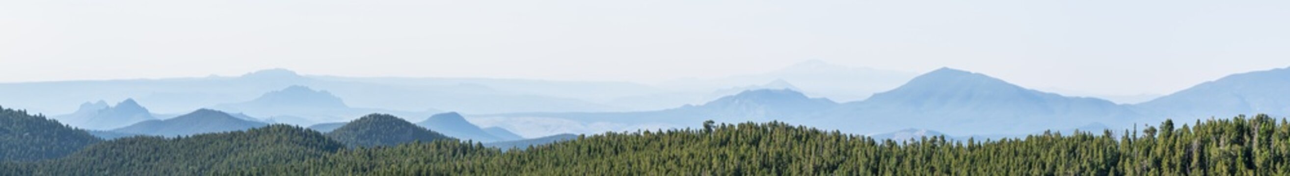 Layers of hazy blue mountains stretching into distance