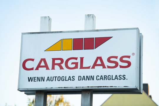 Carglass brand sign and logo, leading specialist in vehicle glass repair and replacement in Trier, Germany, stone chip, crack in windshield of car