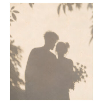 Intimate Couple Shadow Embracing and Kissing on Warm Beige Wall with Leaves