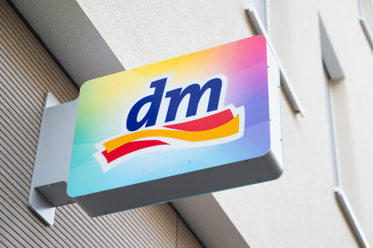 DM drogerie market logo sign, store chain offering cosmetics, healthcare items, household products and health food and drink, company branch in Trier, Germany