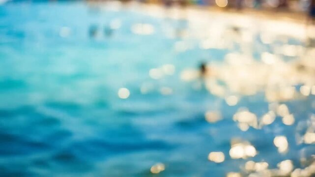 A soft blurred view of ocean waves reflecting bright sunlight