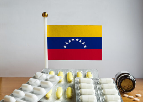 Flag of Venezuela with Pills and Capsules. Pharmaceutical Concept
