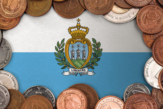 Coins on flag of San Marino trading investment business currency concept
