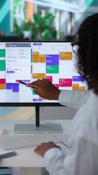 Businesswoman Carefully Reviewing Calendar