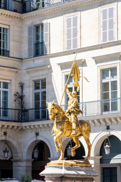 Paris, France - June 17, 2026: Three-quarter front view of the gilded bronze equestrian statue of Joan of Arc by Emmanuel Fremiet, erected in the Pyramides square in 1874.