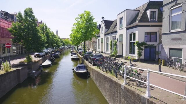 Picturesque Canal in Haarlem, Netherlands with Boats and Bikes