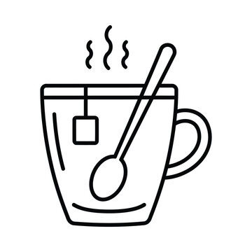 A steaming hot cup of tea with a spoon and tea bag inside