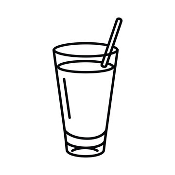 A refreshing drink with a straw in a tall glass on the table indoors
