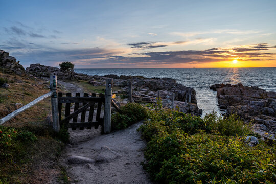 Denmark, Bornholm, Coastal trail on island at sunset