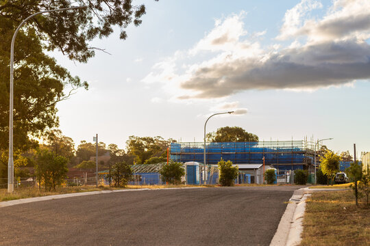 new building under construction in suburb of Singleton Heights at sunset