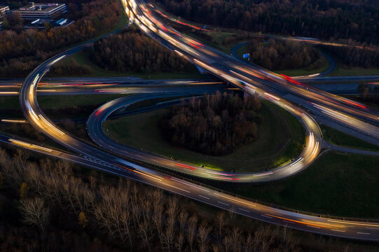 Germany, Baden-Wurttemberg, Stuttgart, Aerial view of vehicle light trails on Bundesautobahn 8 at dusk