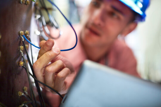 Electrician testing wires