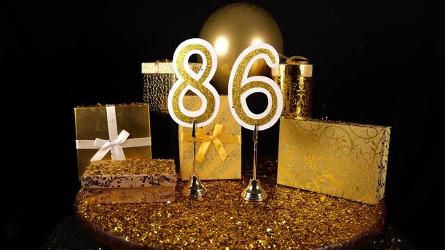 Gold Number 86 with Gold Glitter Confetti Sparkles with Gifts and Balloons for Party Eighty Six