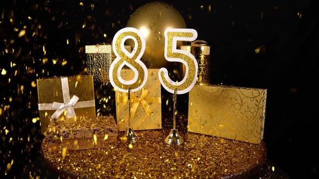 Gold Number 85 with Gold Glitter Confetti Sparkles with Gifts and Balloons for Party Eighty Five