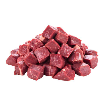 A large pile of freshly cut raw red meat cubes stacked high on a clean white background for cooking or recipe use