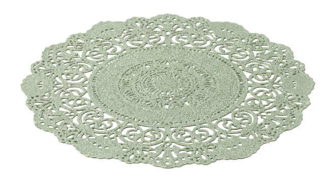 Elegant pale green lacy doily with intricate floral patterns and glittery texture